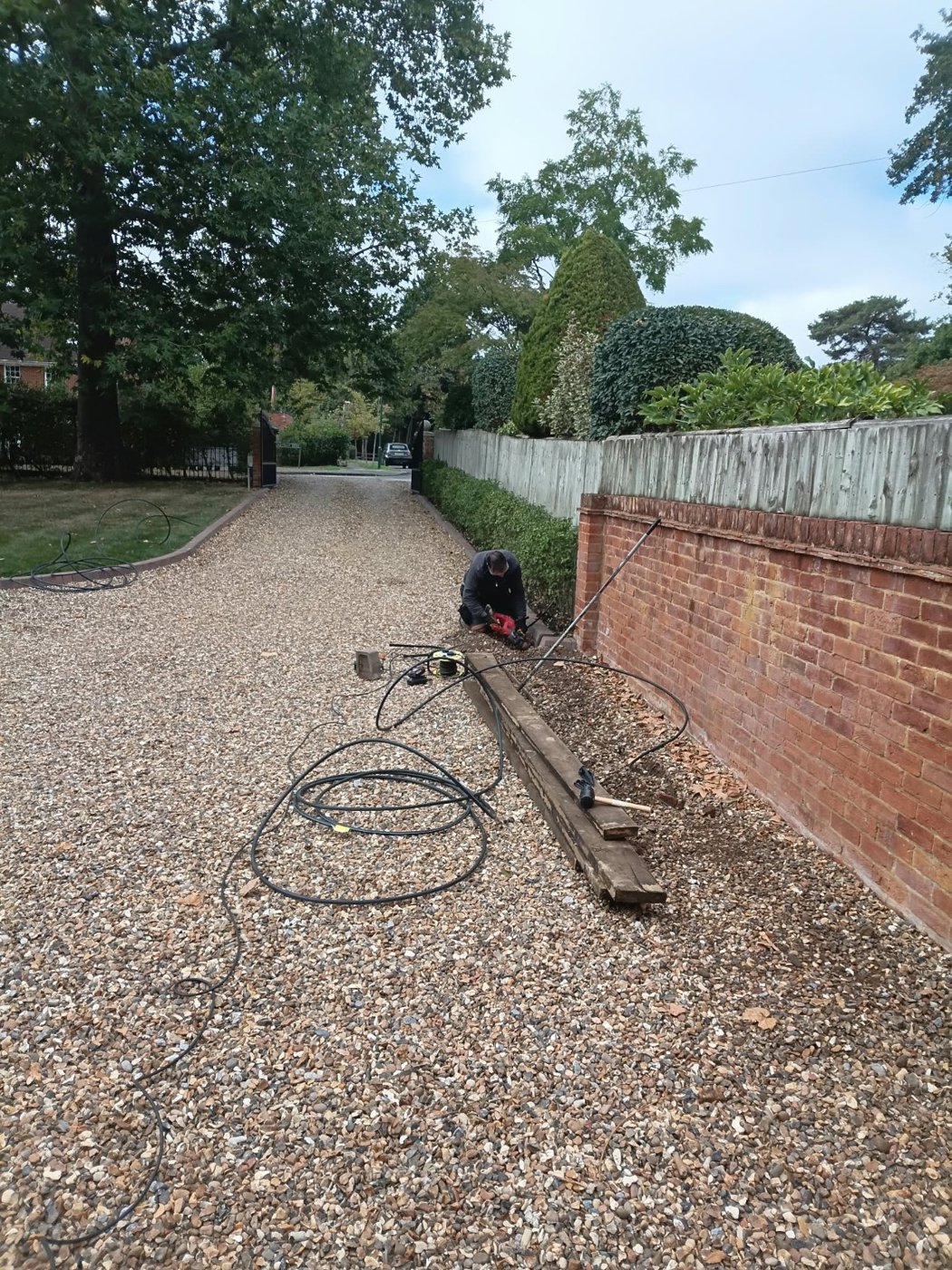 Installing irrigation along the garden boundary